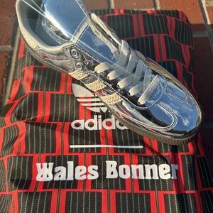 adidas metallic silver low-top sneaker with cream stripes